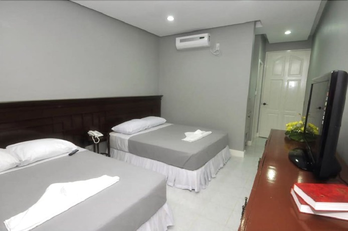 Imagen de la habitación del Hotel Kapis Mansions Hotel. Foto 8