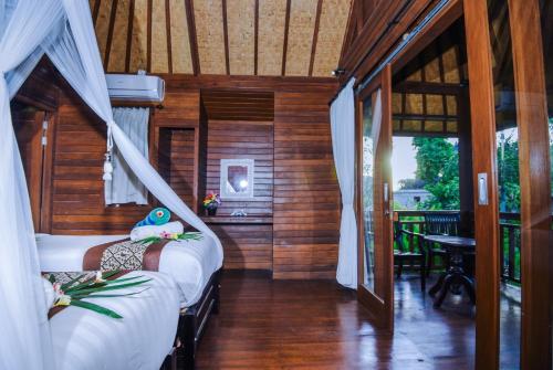 Imagen de la habitación del Hotel Karang Mas Villa by WizZeLa. Foto 6