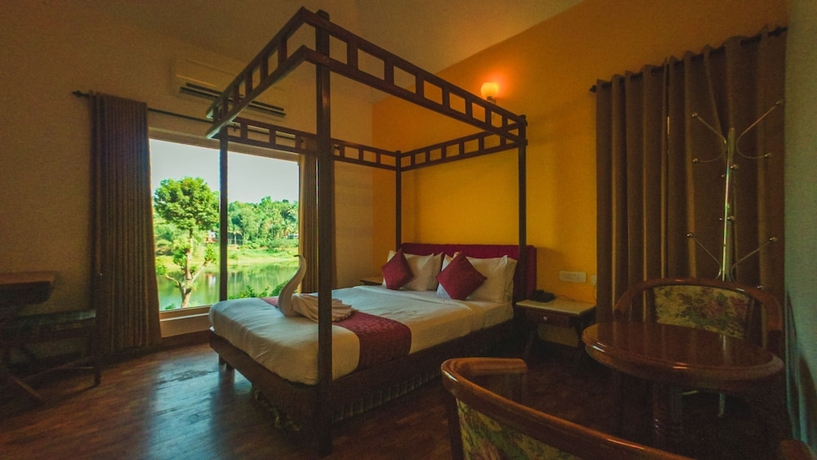 Imagen de la habitación del Hotel Karapuzha Village Resort. Foto 9