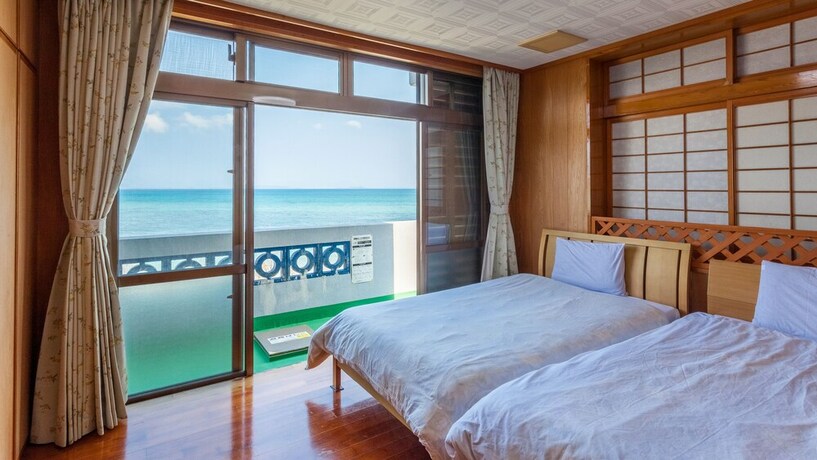 Imagen de la habitación del Hotel Kariyushi Condominium Resort Kin New Covenant. Foto 13