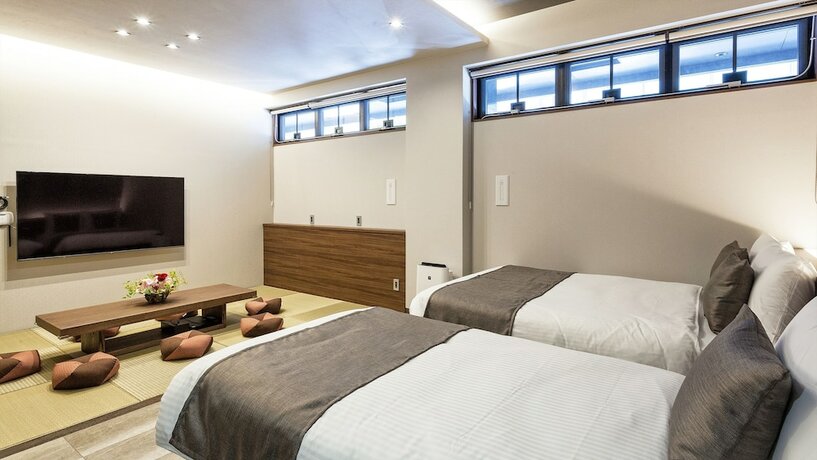 Imagen de la habitación del Hotel Kariyushi Condominium Resort Naha GSA. Foto 11
