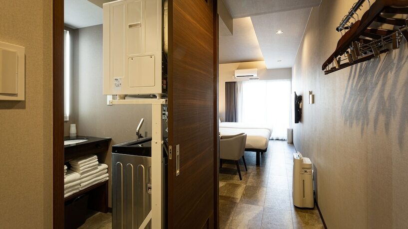 Imagen de la habitación del Hotel Kariyushi Condominium Resort Naha GSA. Foto 12