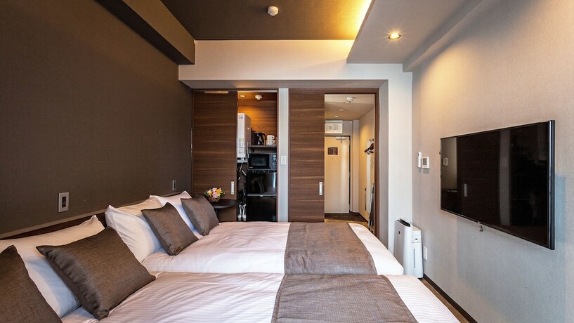 Imagen de la habitación del Hotel Kariyushi Condominium Resort Naha GSA. Foto 16