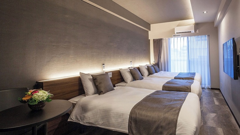 Imagen de la habitación del Hotel Kariyushi Condominium Resort Naha GSA. Foto 17