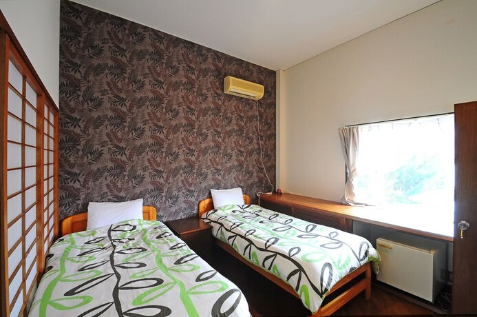 Imagen de la habitación del Hotel Kariyushi Condominium Resort Yuudekiya. Foto 9
