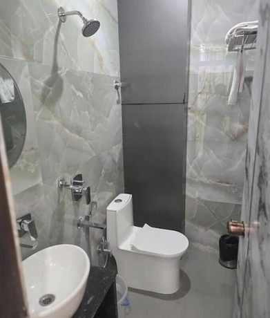 Imagen de la habitación del Hotel Kashi Ganga Inn. Foto 12