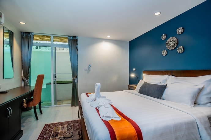 Imagen de la habitación del Hotel Kata Tranquil Villa. Foto 4