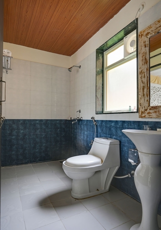 Imagen de la habitación del Hotel Kavish Holiday Hill Resort. Foto 19