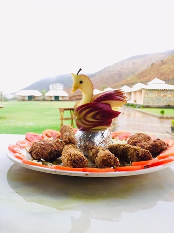 Imagen del bar/restaurante del Hotel Kavish Holiday Hill Resort. Foto 5