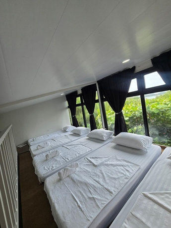 Imagen de la habitación del Hotel Kawan Beach House and Sanctuary. Foto 12