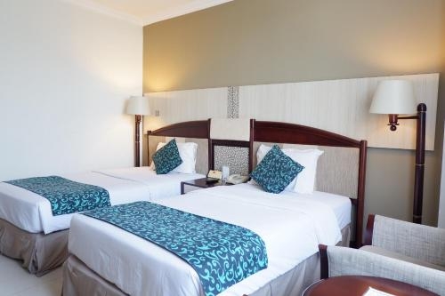 Imagen de la habitación del Hotel Kedaton, Bandung. Foto 10