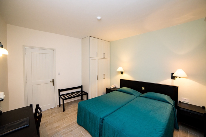 Imagen de la habitación del Hotel Kefalos Beach Tourist Village. Foto 8