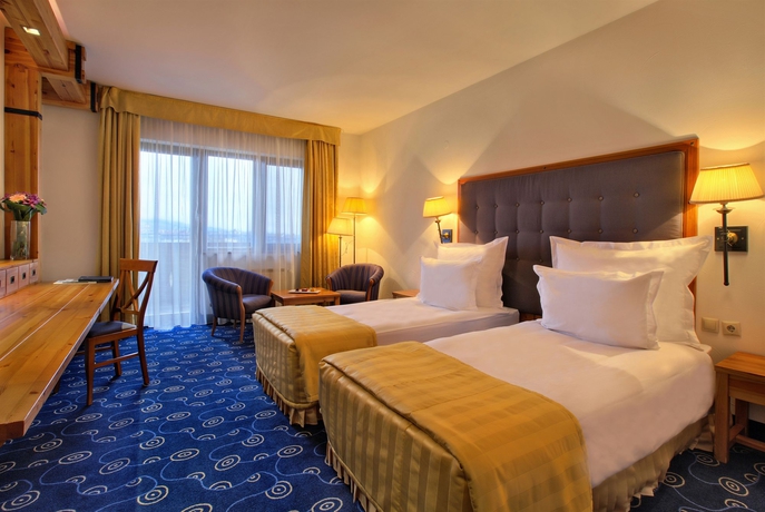 Imagen de la habitación del Hotel Kempinski Grand Arena. Foto 9