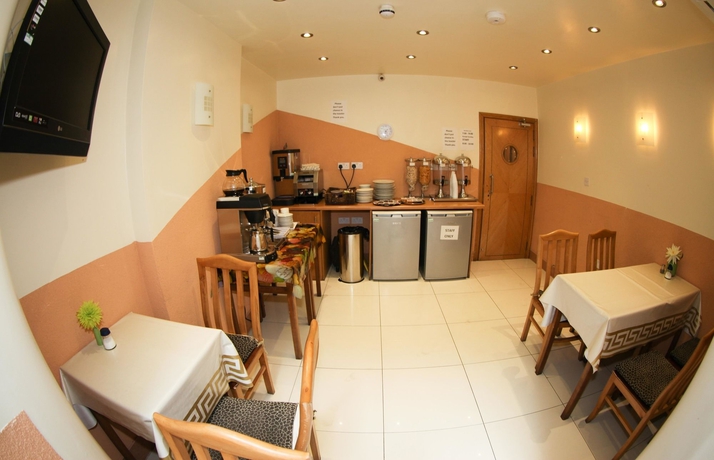 Imagen del bar/restaurante del Hotel Kensington Suite. Foto 6