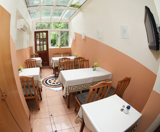 Imagen del bar/restaurante del Hotel Kensington Suite. Foto 7