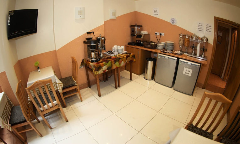 Imagen del bar/restaurante del Hotel Kensington Suite. Foto 8