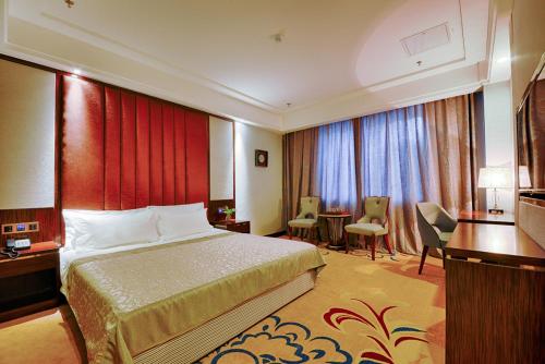 Imagen de la habitación del Hotel Kew Green Changchun. Foto 16