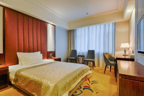 Imagen de la habitación del Hotel Kew Green Changchun. Foto 17