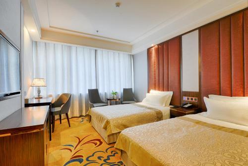 Imagen de la habitación del Hotel Kew Green Changchun. Foto 18