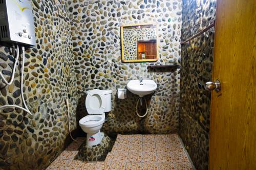 Imagen de la habitación del Hotel Khaosok Riverside Cottages. Foto 13