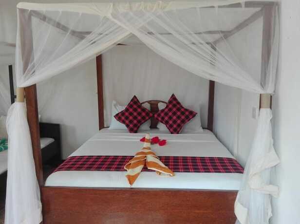 Imagen de la habitación del Hotel Kihori Bungalows. Foto 19