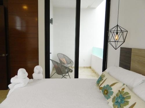 Imagen de la habitación del Hotel Kiin Luxury Condos Riviera Maya. Foto 8