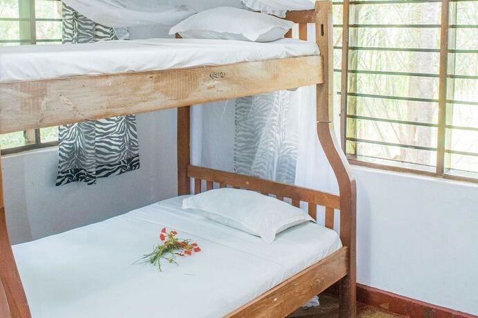 Imagen de la habitación del Hotel Kijani Cottages Diani. Foto 15