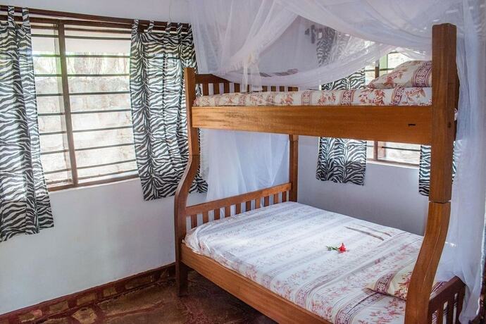 Imagen de la habitación del Hotel Kijani Cottages Diani. Foto 18