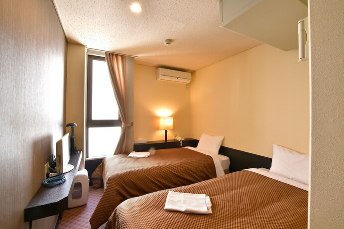 Imagen de la habitación del Hotel Kikuei Namba. Foto 17