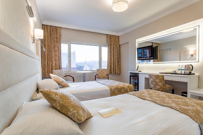 Imagen de la habitación del Hotel Kilim Otel Izmir. Foto 11