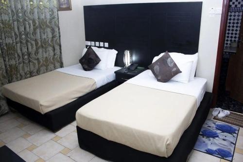 Imagen de la habitación del Hotel Kingdom, Ciudad de Mwanza. Foto 17