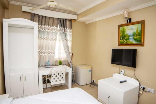 Imagen de la habitación del Hotel Kingdom, Ciudad de Mwanza. Foto 19