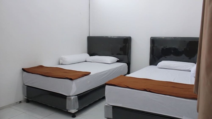 Imagen de la habitación del Hotel Kingkost Kenari Kudus. Foto 14