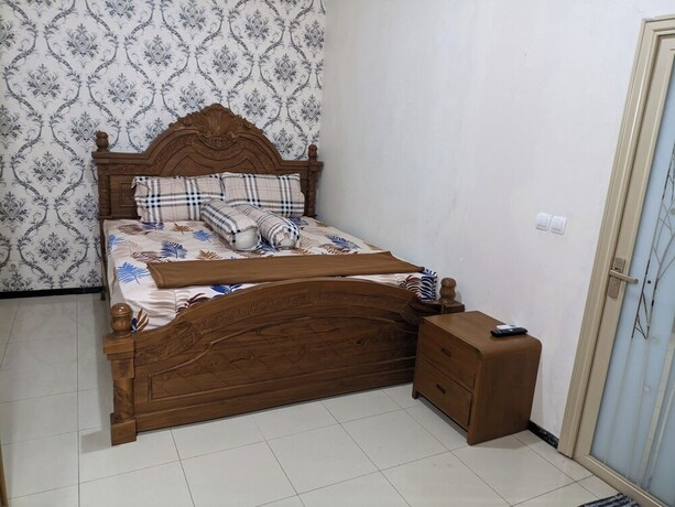 Imagen de la habitación del Hotel Kingkost Kenari Kudus. Foto 18