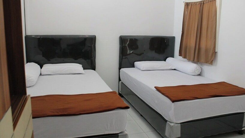 Imagen de la habitación del Hotel Kingkost Kenari Kudus. Foto 19