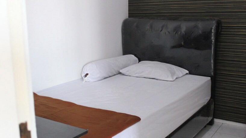 Imagen de la habitación del Hotel Kingkost Kenari Kudus. Foto 20