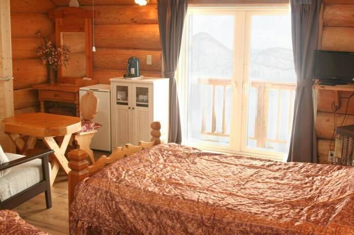 Imagen de la habitación del Hotel Kitutuki Canadian Club. Foto 19