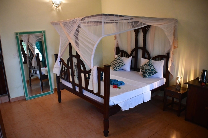 Imagen de la habitación del Hotel Kiwengwa Bungalow Boutique Resort. Foto 13