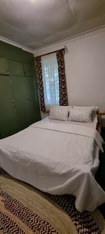 Imagen de la habitación del Hotel Kizumba House. Foto 19