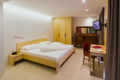Imagen de la habitación del Hotel Kleinkunsthotel. Foto 9