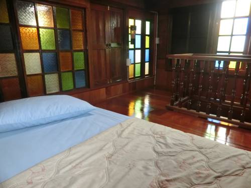 Imagen de la habitación del Hotel Klong Suan Plu Resort. Foto 11