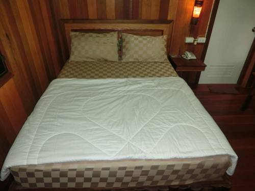 Imagen de la habitación del Hotel Klong Suan Plu Resort. Foto 12