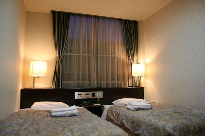 Imagen de la habitación del Hotel Kochi Business Bekkan. Foto 11