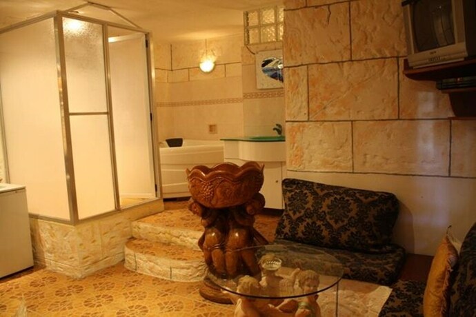 Imagen de la habitación del Hotel Kokomos Beach Resort. Foto 19