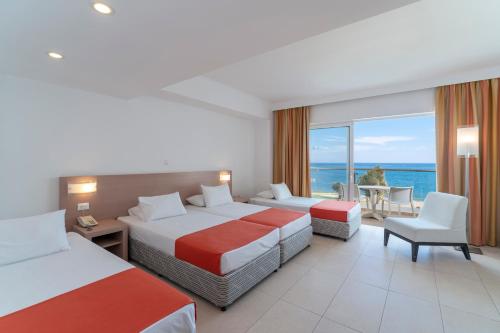 Imagen de la habitación del Hotel Kolymbia Beach by Atlantica. Foto 18