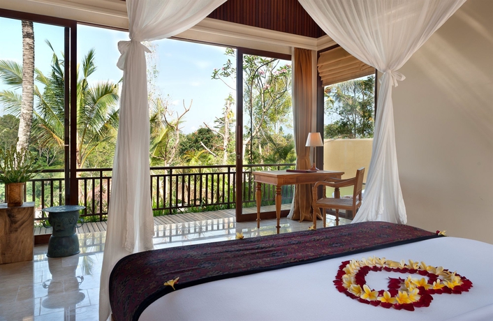 Imagen de la habitación del Hotel Komaneka At Tanggayuda. Foto 11