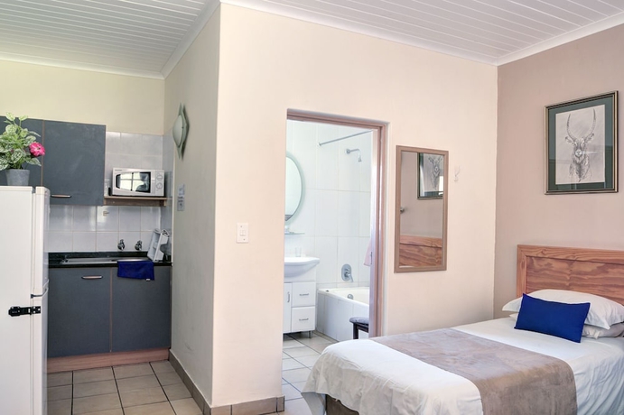 Imagen de la habitación del Hotel Komati River Chalets. Foto 10