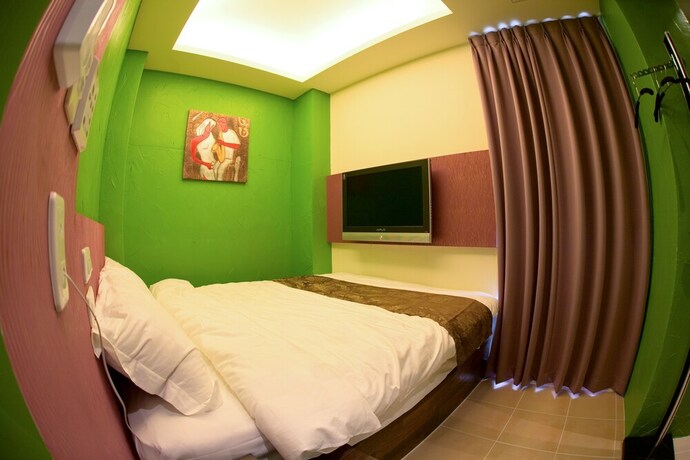 Imagen de la habitación del Hotel K-one Homestay. Foto 18