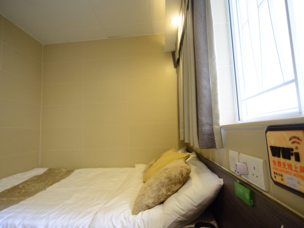 Imagen de la habitación del Hotel Kong Hing Guest House. Foto 2