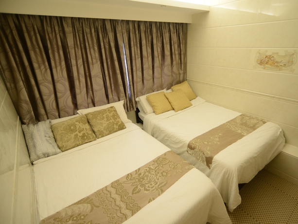 Imagen de la habitación del Hotel Kong Hing Guest House. Foto 5